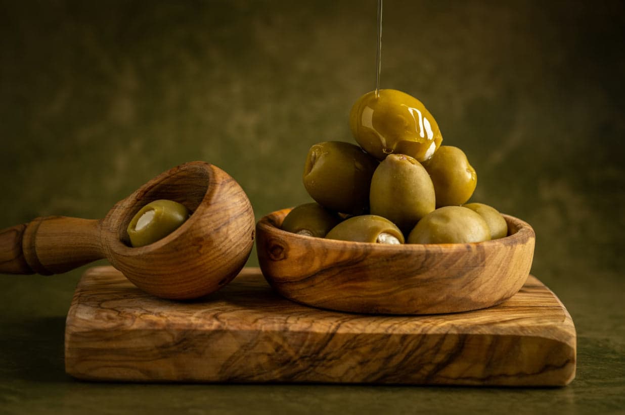Extra virgin olive oil being poured, a food of the Mediterranean diet